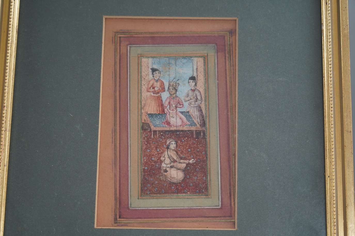 19th century Indian School in Moghul style, watercolour on card, Nobleman and attendants, 11 x 5cm, overall visible sheet 17 x 10.5cm. Condition - fair